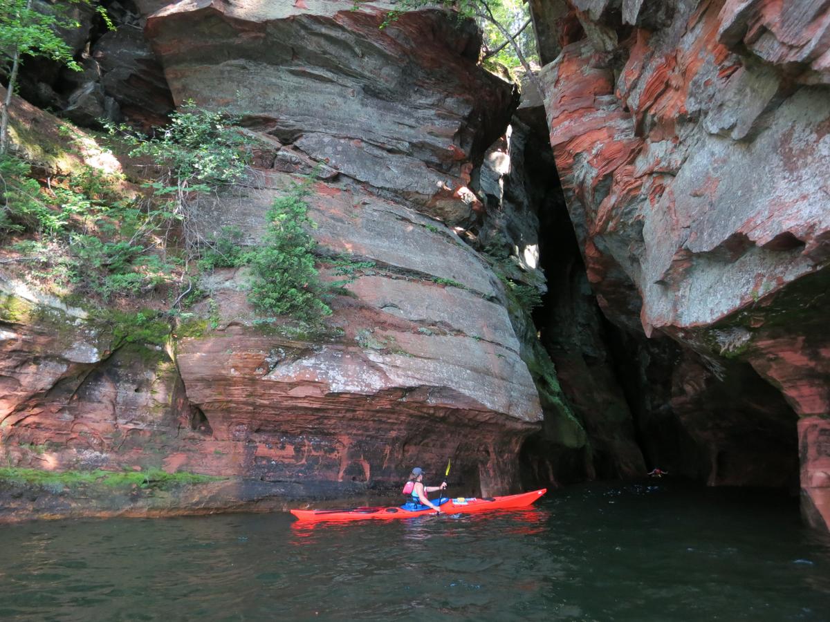 A kayaker explores the Apostle Islands National Lakeshore. (Kevin Revolinski)