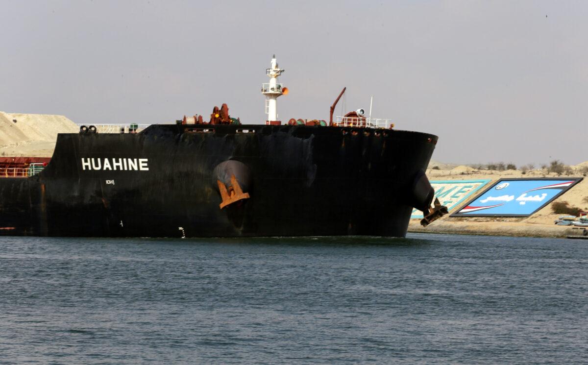 A ship is seen after sailing through Suez Canal as traffic resumes after a container ship that blocked the waterway was refloated, in Ismailia, Egypt, on March 30, 2021. (Hanaa Habib/Reuters)