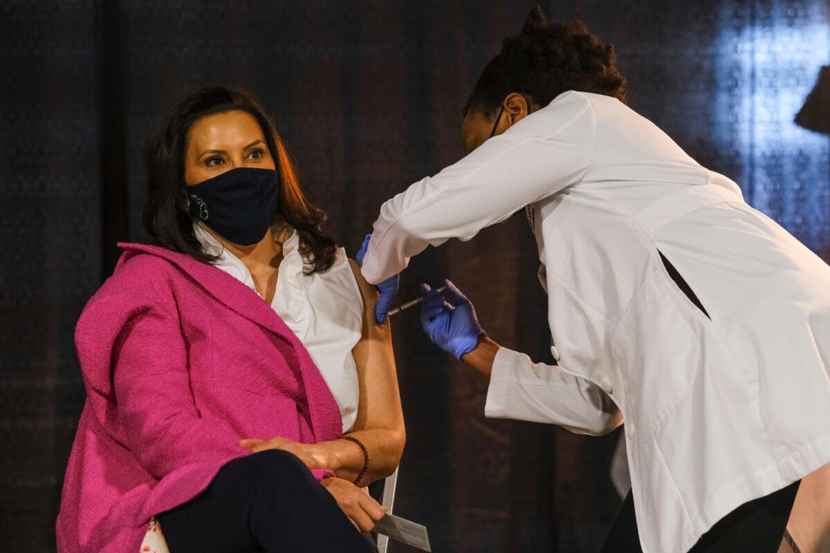 Michigan Gov. Gretchen Whitmer receives a dose of the Pfizer COVID-19 vaccine at Ford Field during an event to promote and encourage Michigan residents to get the vaccine, in Detroit, on April 6, 2021. (Matthew Hatcher/Getty Images)