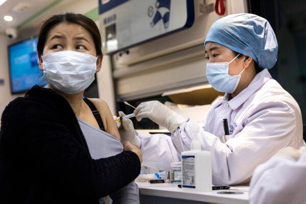 A woman receives the COVID-19 vaccine on the move vaccination vehicle in Wuhan, China on April 8, 2021. (Getty Images)