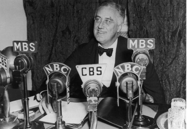President Franklin D. Roosevelt seated in front of a number of television and radio station microphones in Washington, on Oct. 14, 1938. (Fotosearch/Getty Images)