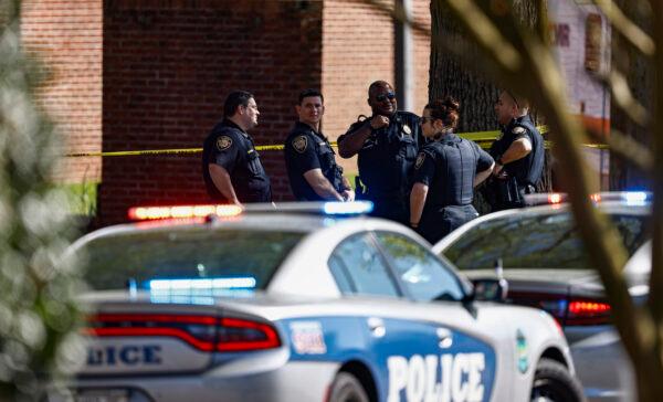 Knoxville police work the scene of a shooting at Austin East High School in Knoxville, Tenn., on April 12, 2021. (AP Photo/Wade Payne)