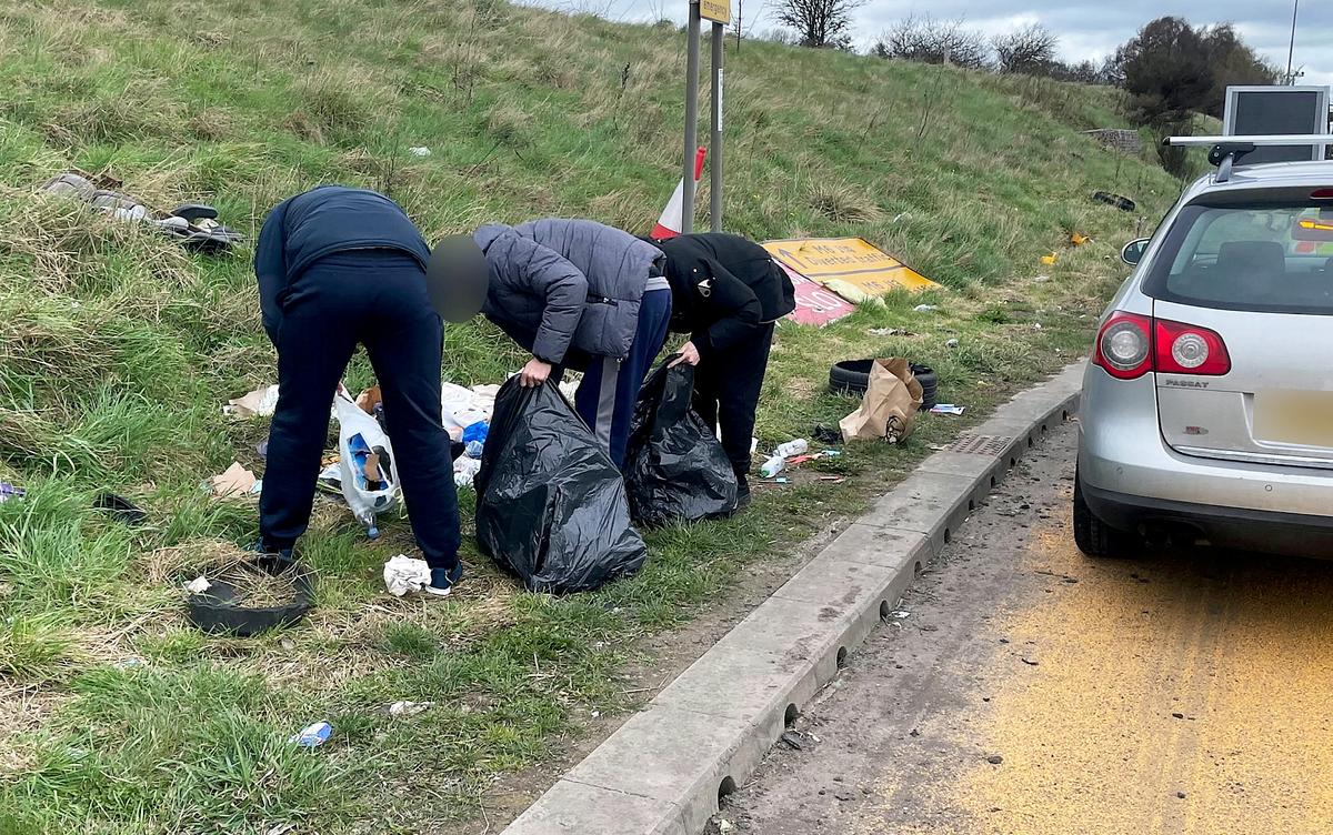 A group of males were caught by Highways CCTV camera operators dumping rubbish from their VW Passat on the M6 motorway between junctions 12 and 13 in Staffordshire, England, on March 28. (SWNS)