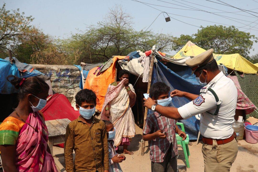 India’s Capital to Lock Down Amid Devastating Virus Surge