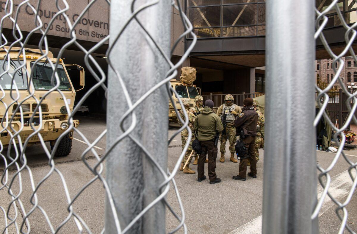 Law enforcement and National Guard members stage outside the Hennepin County Government Center in Minneapolis, Minn., on April 19, 2021. (Stephen Maturen/Getty Images)