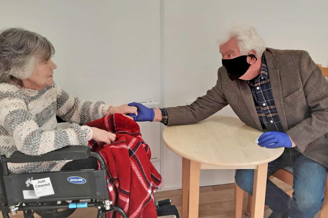 Man, 74, Gets to Hold the Hand of His Wife in Care Home for the First Time in 8 Months