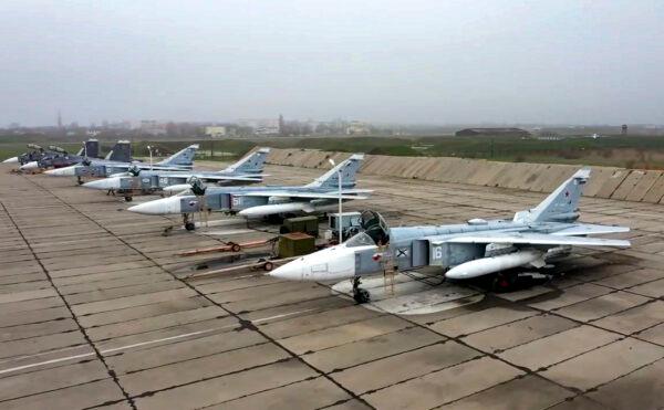 Russian Su-24 bombers parked at an air base in Crimea in preparation for maneuvers, in a photo released on April 22, 2021. (Russian Defense Ministry Press Service via AP)