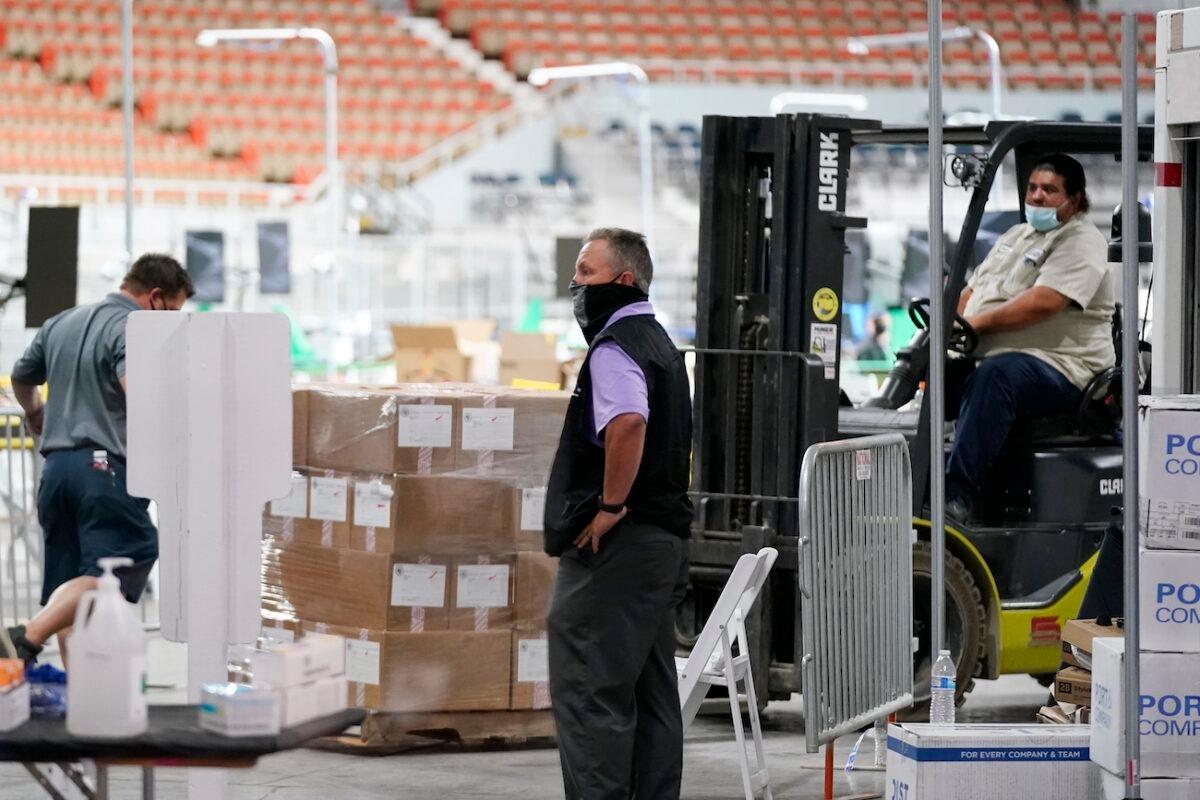Some of the 2.1 million ballots cast during the 2020 election, are brought in for recounting at a 2020 election ballot audit ordered by the Arizona Senate at the Arizona Veterans Memorial Coliseum, in Phoenix, Arizona, on April 22, 2021. (Ross D. Franklin/AP Photo)