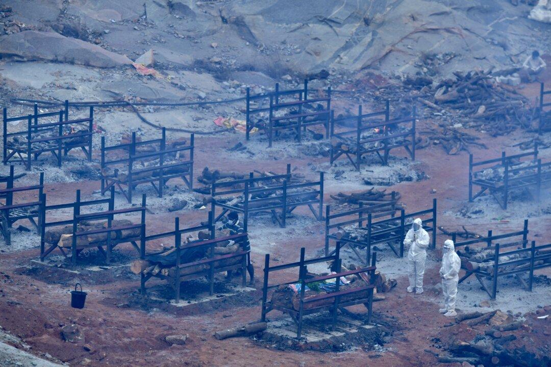 India’s COVID-19 Daily Cases Stay Near Record, Another State Imposes Lockdown