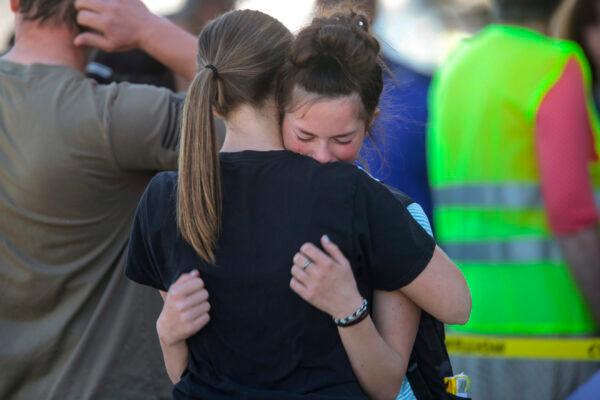 Students embrace after a school shooting at Rigby Middle School in Rigby, Idaho, on May 6, 2021. (John Roark/The Idaho Post-Register via AP)