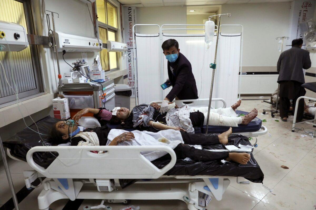 Afghan school students are treated at a hospital after a bomb explosion near a school in the west of Kabul, Afghanistan, on May 8, 2021. (Rahmat Gul/AP Photo)