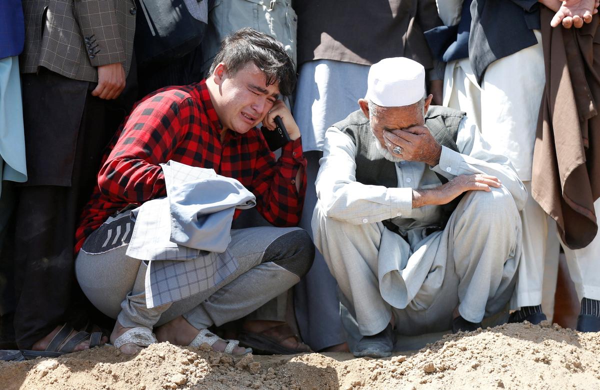 Afghan School Blast Toll Rises to 68, Families Bury Victims
