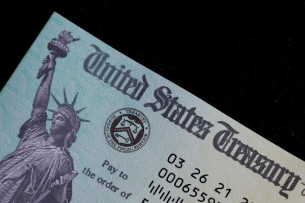 A family's stimulus check from the U.S. Treasury for the coronavirus disease (COVID-19) aid arrived in the mail in Milton, Mass., on March 25, 2021. (Brian Snyder/Reuters)