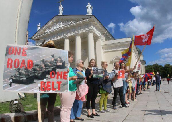 People take part in a human chain protest in support of the Hong Kong Way, a recreation of a pro-democracy "Baltic Way" protest against Soviet rule three decades ago, in Vilnius, Lithuania, on Aug. 23, 2019. (Petras Malukas/AFP via Getty Images)
