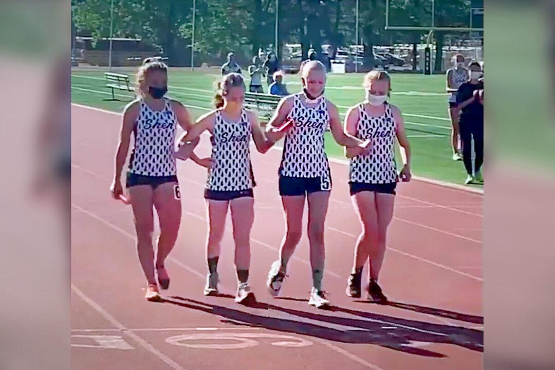 Video Shows Track Team Helping Fellow Runner Battling Cancer Cross Finish Line—and It Goes Viral