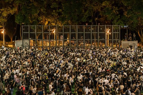 Participants hold candles as they take part in a memorial vigil in Victoria Park in Hong Kong, on June 4, 2020. (Anthony Kwan/Getty Images)