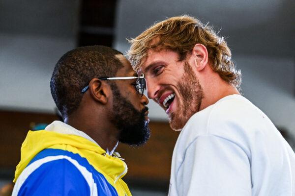Former world welterweight king Floyd Mayweather (L) and YouTube personality Logan Paul face off during the media availability ahead of their June 6 exhibition boxing match, at Villa Casa Casuarina at the former Versace Mansion in Miami Beach on June 3, 2021. (Chandan Khanna/AFP via Getty Images)
