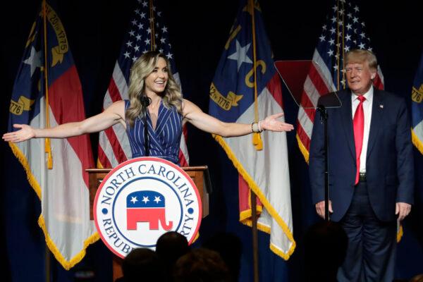 Former President Donald Trump, right, listens as his daughter-in-law Lara Trump speaks at the North Carolina Republican Convention in Greenville, N.C., on June 5, 2021. (AP Photo/Chris Seward)