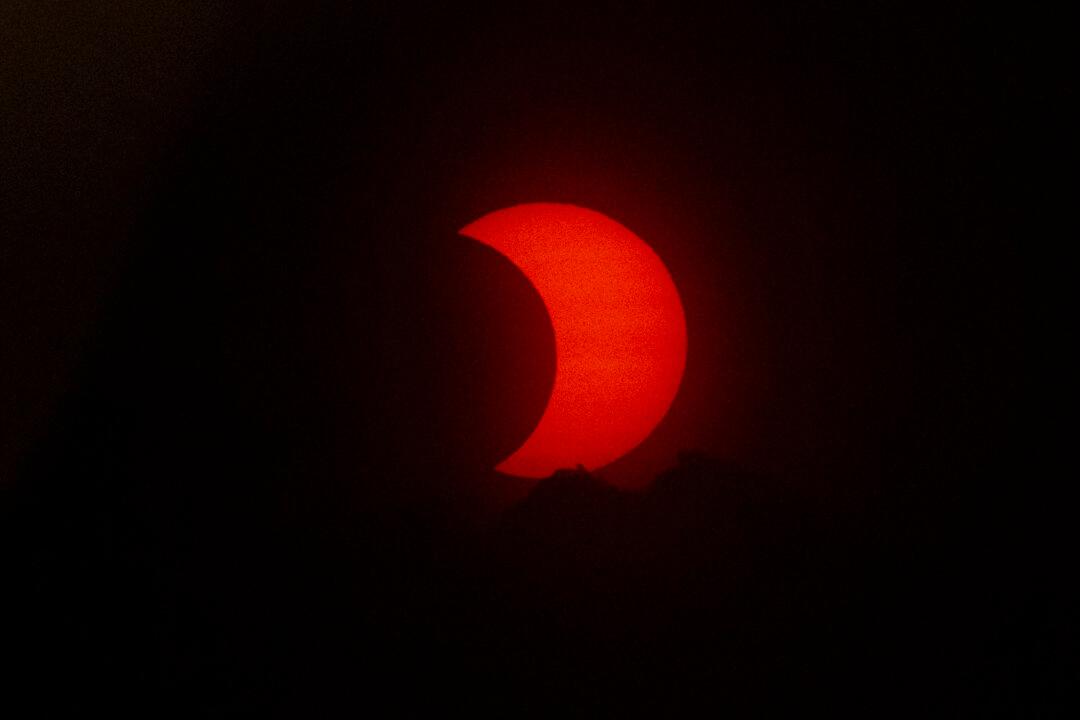 See the Spectacular Solar Eclipse Painting the Sky Red in New Jersey