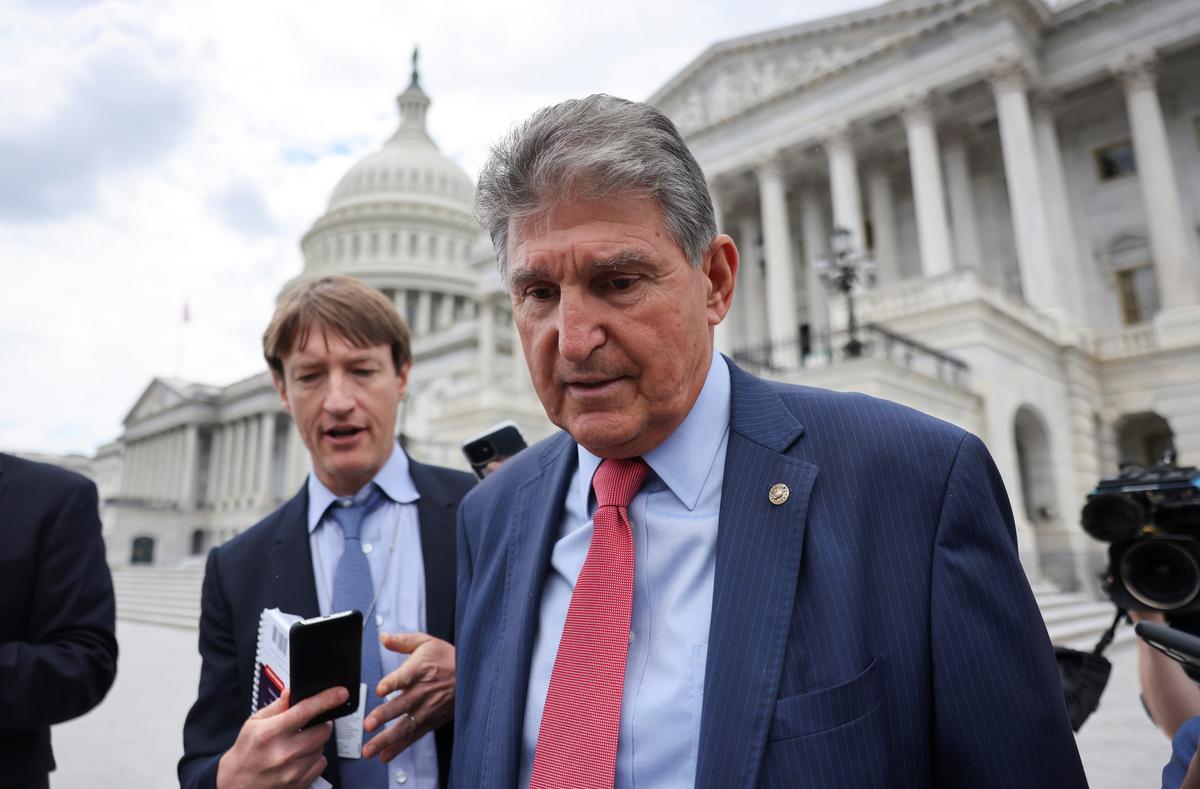 Sen. Joe Manchin (D-W.Va.) talks to reporters as he departs the U.S. Capitol after a vote in the Senate in Washington, on June 10, 2021. (Evelyn Hockstein/Reuters)