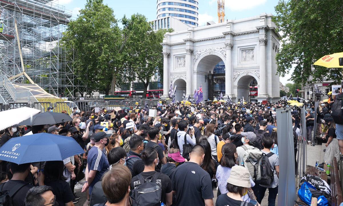 Supporters of Hong Kong's pro-democracy movement gather at a rally at Marble Arch in London on June 12, 2021. (Yanning Qi/The Epoch Times)
