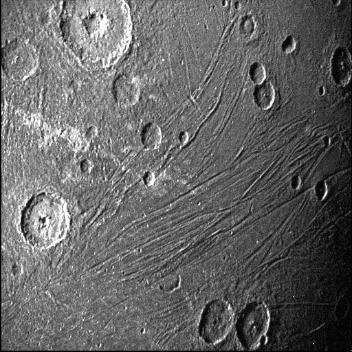 This June 7, 2021, image made available by NASA shows the dark side of the Jovian moon Ganymede as the Juno spacecraft flies by. (NASA/JPL-Caltech/SwRI via AP)