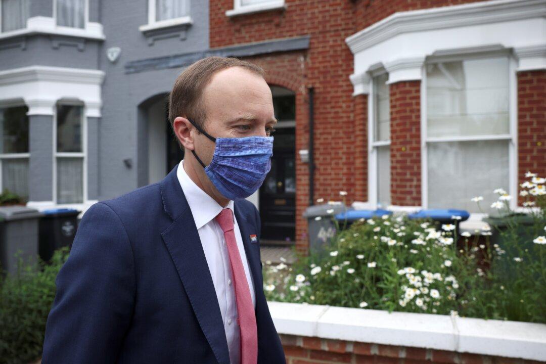 UK Health Minister ‘Very Sorry’ After Pictured Kissing Aide