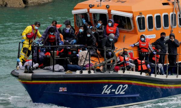 Following a small boat incident, a group of migrants are onboard a lifeboat in Dover, Kent, on July 4, 2021. (Gareth Fuller/PA)