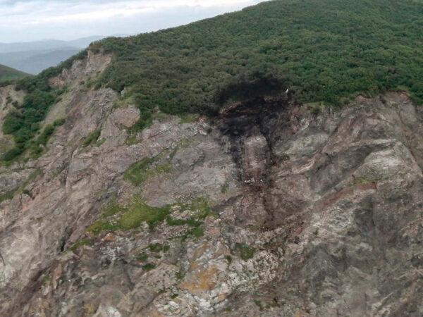 Wreckage of a missing Antonov An-26 missing plane found near its destination airport outside the town of Palana, in Russia's Far East, in a photo released on July 7, 2021. (Russia Emergency Situations Ministry press service via AP)