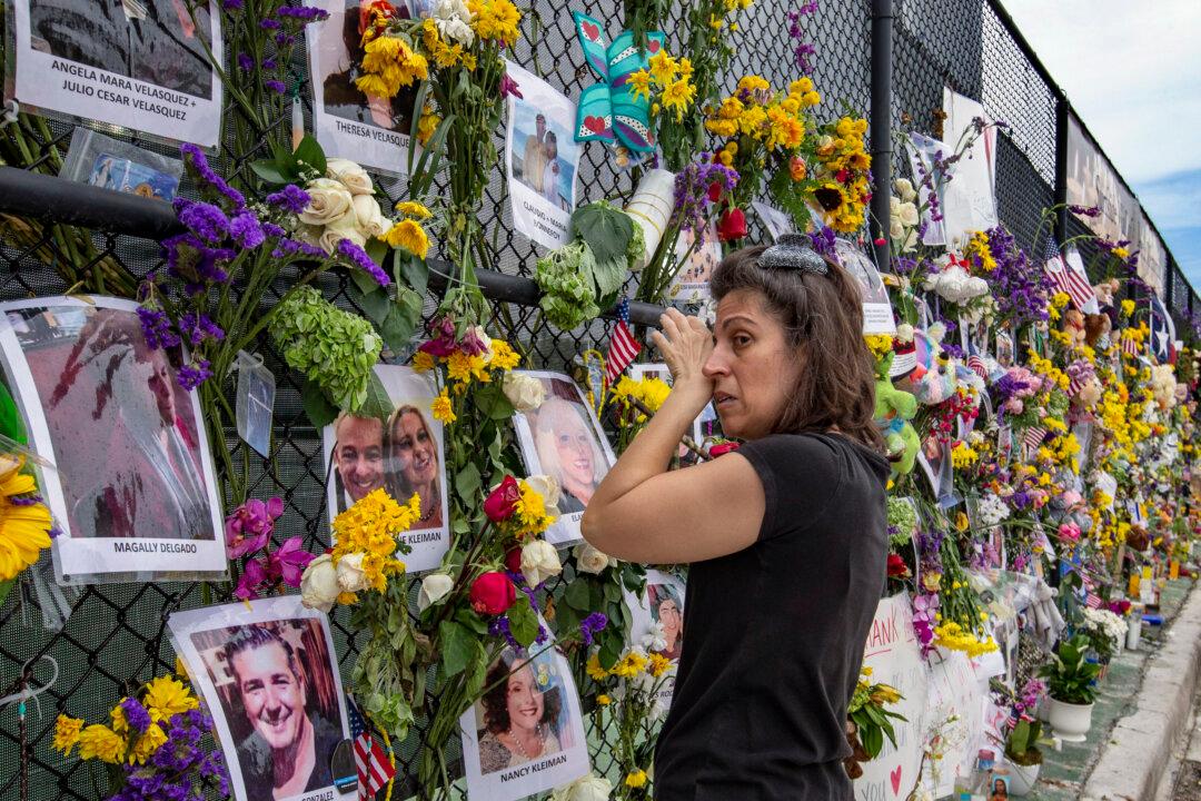 Families, Rescuers Hold Vigil Near Collapsed Building