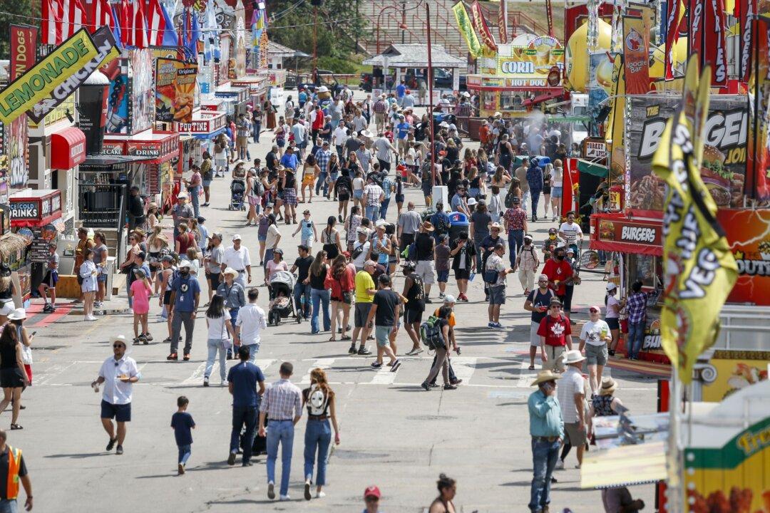 Rodeos, Reunions, and Hugs as Health Orders Vanish out West