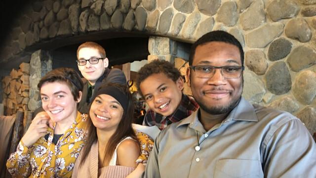 Dr. Gedney's husband, Clifton Maclin, with the 5 children they mentored together before Clifton Maclin died. (Courtesy of Karen Gedney)