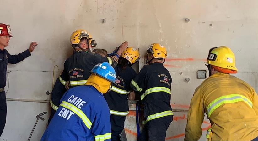 Firefighters Rescue Woman Wedged Between Two Concrete Walls