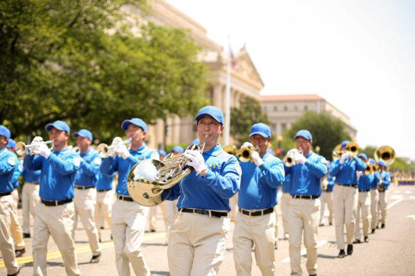 Falun Gong practitioners take part in a parade marking the 22nd anniversary of the start of the Chinese regime's persecution of Falun Gong, in Washington on July 16, 2021. (Samira Bouaou/The Epoch Times)