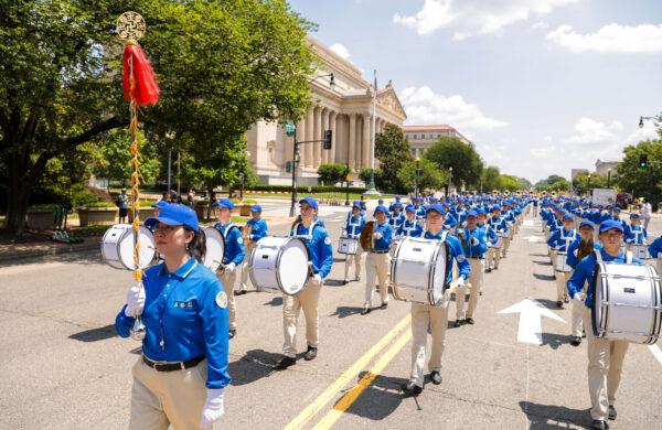 Falun Gong practitioners take part in a parade marking the 22nd anniversary of the start of the Chinese regime's persecution of Falun Gong, in Washington on July 16, 2021. (Samira Bouaou/The Epoch Times)