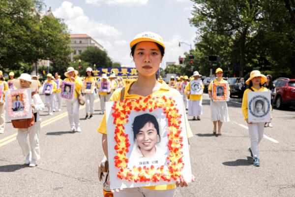 Falun Gong practitioners take part in a parade marking the 22nd anniversary of the start of the Chinese regime's persecution of Falun Gong, in Washington on July 16, 2021. (Samira Bouaou/The Epoch Times)