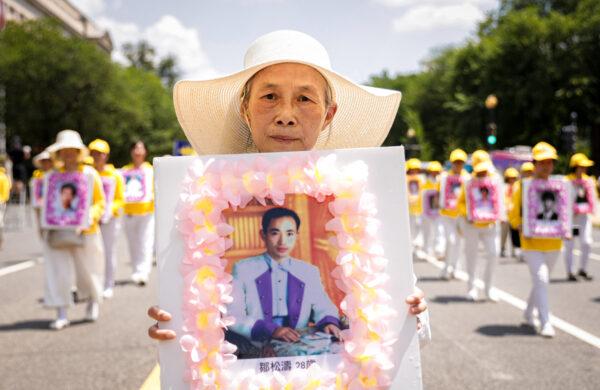 Falun Gong practitioners take part in a parade marking the 22nd anniversary of the start of the Chinese regime's persecution of Falun Gong, in Washington on July 16, 2021. (Samira Bouaou/The Epoch Times)