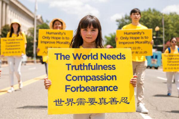 Falun Gong practitioners take part in a parade marking the 22nd anniversary of the start of the Chinese regime's persecution of Falun Gong, in Washington on July 16, 2021. (Samira Bouaou/The Epoch Times)