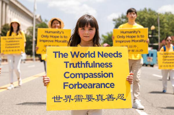 Falun Gong practitioners take part in a parade marking the 22nd anniversary of the start of the Chinese regime's persecution of Falun Gong, in Washington on July 16, 2021. (Samira Bouaou/The Epoch Times)