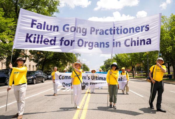 Falun Gong practitioners take part in a parade marking the 22nd anniversary of the start of the Chinese regime's persecution of Falun Gong, in Washington on July 16, 2021. (Samira Bouaou/The Epoch Times)