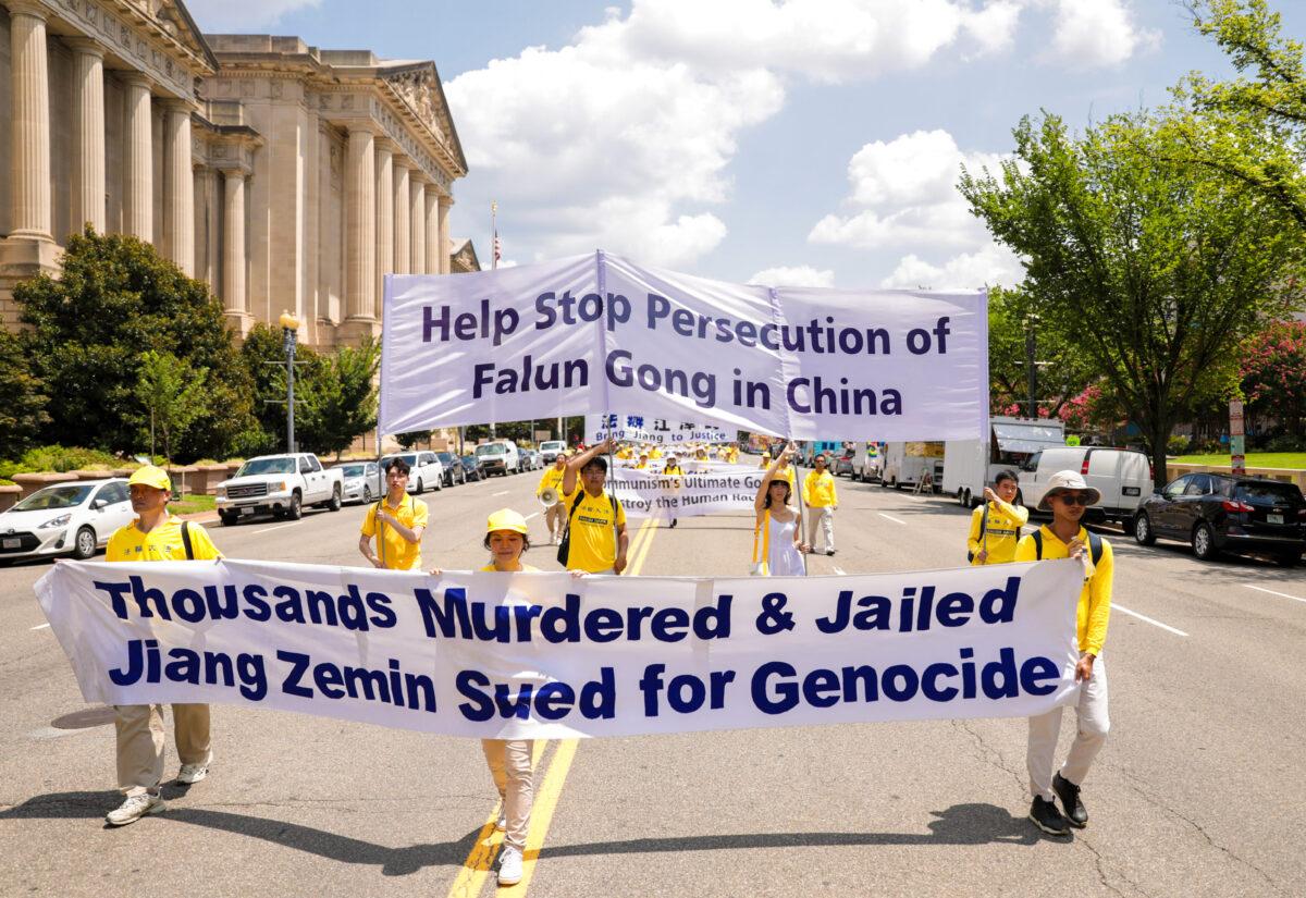 Falun Gong practitioners take part in a parade marking the 22nd anniversary of the start of the Chinese regime's persecution of Falun Gong, in Washington on July 16, 2021. (Samira Bouaou/The Epoch Times)