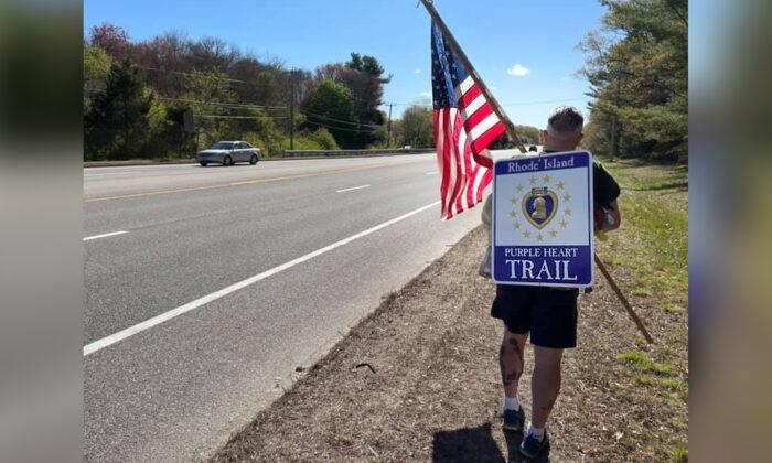 Veterans’ Advocate Hikes New ‘Purple Heart Trail’ in the Rain With Huge American Flag in Rhode Island