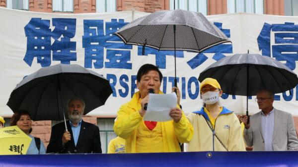Shenli Lin, a Falun Gong adherent who was rescued to Canada in February 2002, speaks at the rally in Queen's Park, Toronto, on July 17, 2021. (Andrew Chen/The Epoch Times)