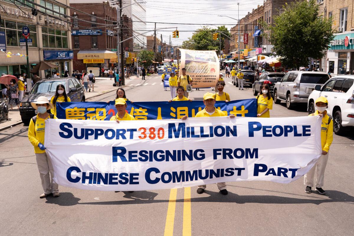 Falun Gong practitioners take part in a parade marking the 22nd year of the persecution of Falun Gong in China, in Brooklyn, N.Y., on July 18, 2021. (Larry Dye/The Epoch Times)