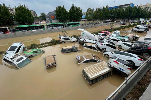 Cars sit in floodwaters after heavy rains hit the city of Zhengzhou in central China's Henan Province on July 21, 2021. (STR/AFP via Getty Images)