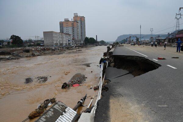 Road collapses after severe flooding and landslides in recent days have hit the county-level city of Gongyi, near Zhengzhou, in central China’s Henan Province on July 22, 2021. (JADE GAO/AFP via Getty Images)