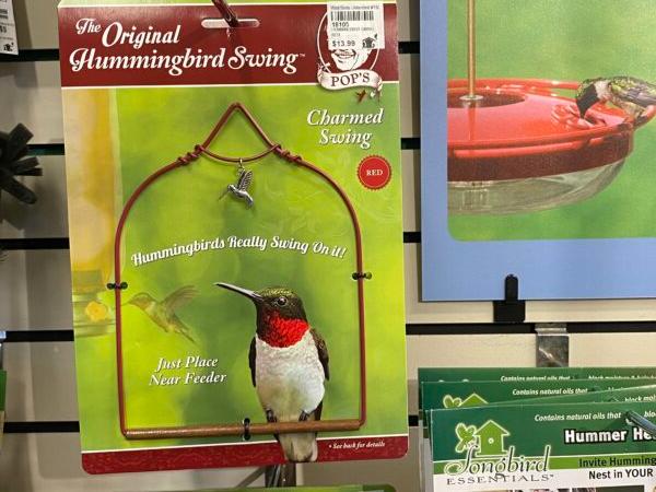 Hummingbirds use hummingbird swings such as the one pictured here that’s sold at Wild Birds Unlimited in Springfield, Illinois. Hummingbirds wait and watch from the swings over their feeders. (Tamara Browning)