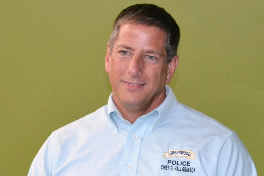 Ex-Police Chief Who Rescued Baby Pleads Guilty to Assault