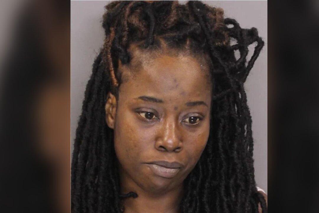 Police Arrest Woman After Finding 2 Dead Children Inside Car