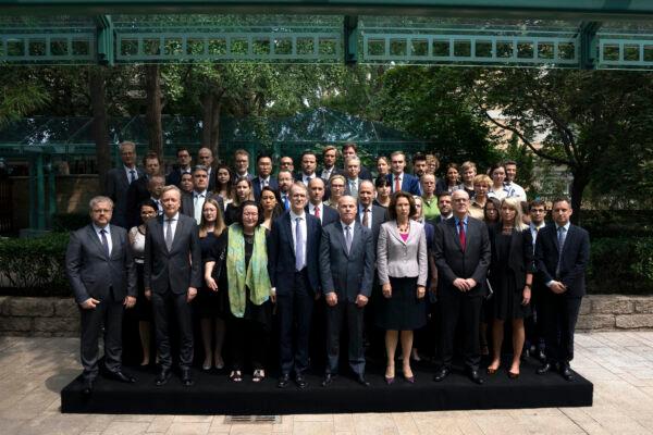 Diplomatic representatives from Canada and more than two dozen other countries pose for a group photo at an event held in connection with the announcement of the sentence for Canadian citizen Michael Spavor at the Canadian Embassy in Beijing on Aug. 11, 2021. (Mark Schiefelbein/AP Photo)